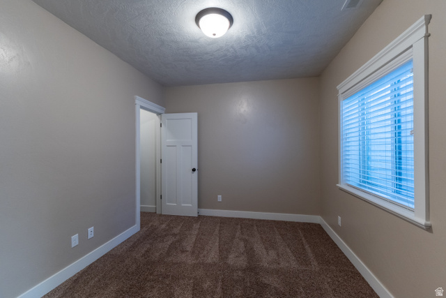 3565 West 1350th Street North Vernal, UT 84078 - Photo 48 of 54 Neutral-toned walls complement the textured brown carpet