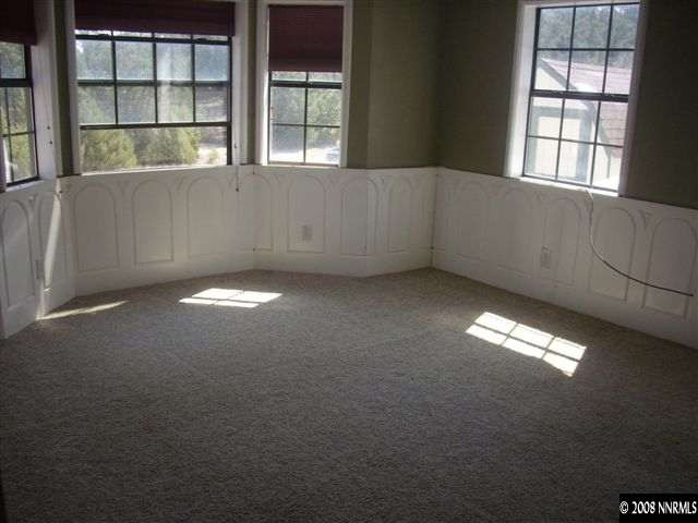 1040 Hamilton Road Reno, NV 89521 - Photo 2 of 9 an empty room with windows