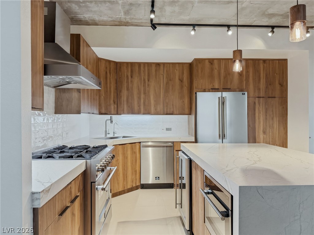 360 East Desert Inn Road, Unit 607 Las Vegas, NV 89109 - Photo 16 of 55 Culinary aspirations come alive in this meticulously appointed kitchen featuring an expansive island and premium appliances.
