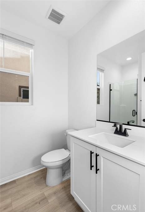 24119 Ashton Corona, CA 92883 - Photo 11 of 45 a bathroom with a granite countertop toilet sink and mirror