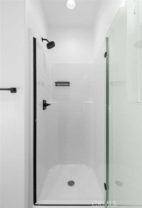 24119 Ashton Corona, CA 92883 - Photo 12 of 45 a bathroom with a glass shower door