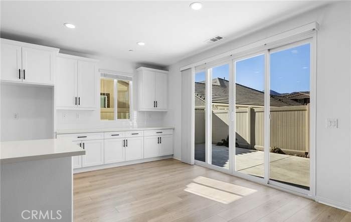 24119 Ashton Corona, CA 92883 - Photo 18 of 45 a bathroom with a tub sink and mirror