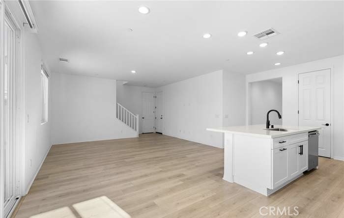 24119 Ashton Corona, CA 92883 - Photo 19 of 45 a view of a kitchen with a sink stainless steel appliances and cabinets