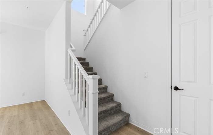 24119 Ashton Corona, CA 92883 - Photo 25 of 45 a view of entryway and hall with wooden floor