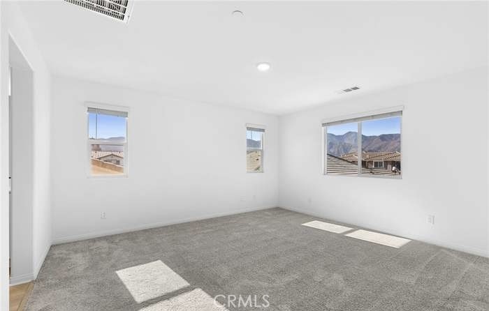 24119 Ashton Corona, CA 92883 - Photo 26 of 45 an empty room with a painting on the wall