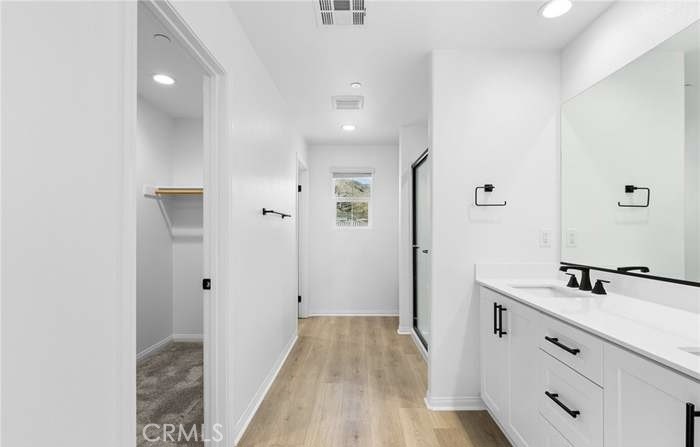 24119 Ashton Corona, CA 92883 - Photo 29 of 45 a bathroom with a sink and a mirror