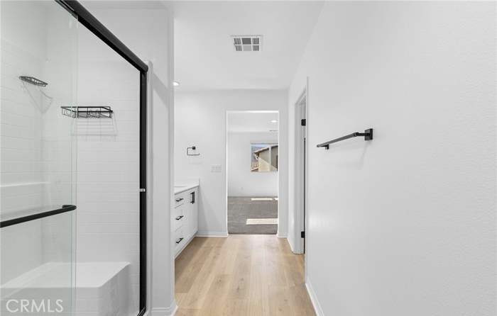 24119 Ashton Corona, CA 92883 - Photo 31 of 45 a view of a bathroom from a hallway