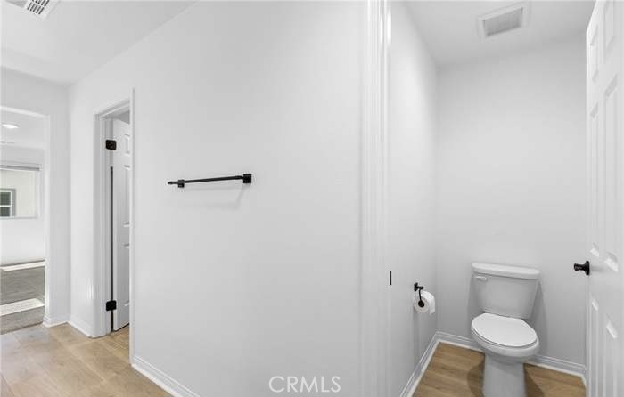 24119 Ashton Corona, CA 92883 - Photo 35 of 45 a bathroom with a toilet and a shower