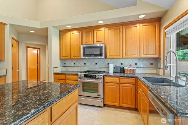 a living room with furniture large window and a fireplace