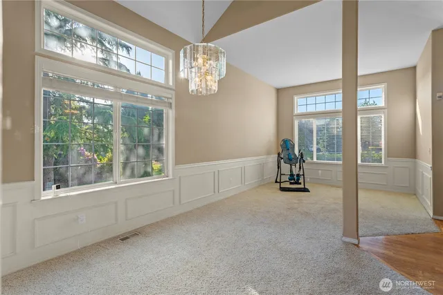 a kitchen with stainless steel appliances granite countertop wooden cabinets and a stove top oven