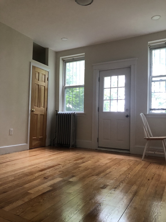 16 Copenger Street, Unit 2 Boston, MA 02120 - Photo 6 of 11 a view of an empty room with a window