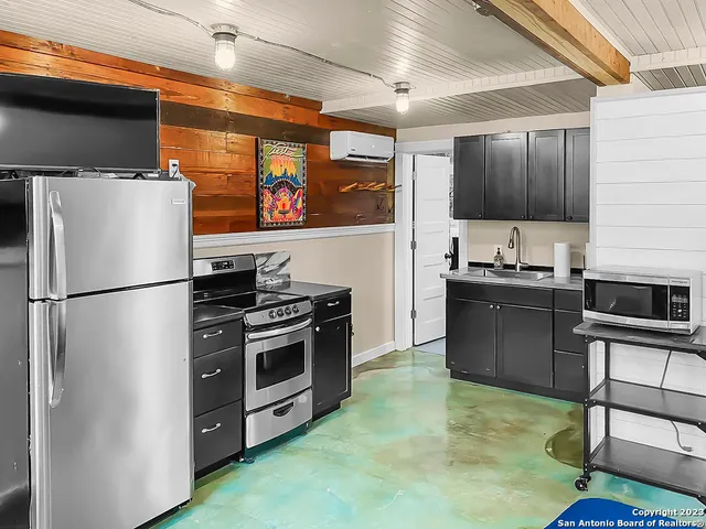 a bedroom with a bed and furniture