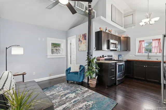 a bedroom with furniture and a chandelier
