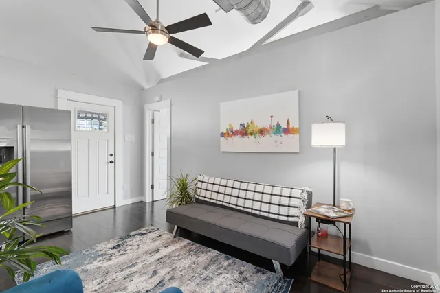 a kitchen with stainless steel appliances granite countertop a sink a stove dining table and chairs