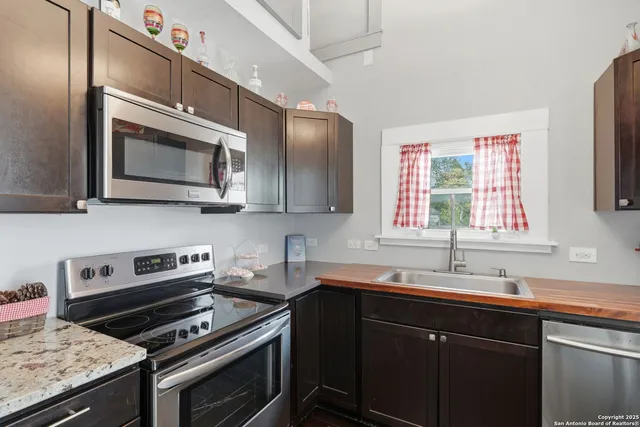 a view of a room with furniture and wooden floor