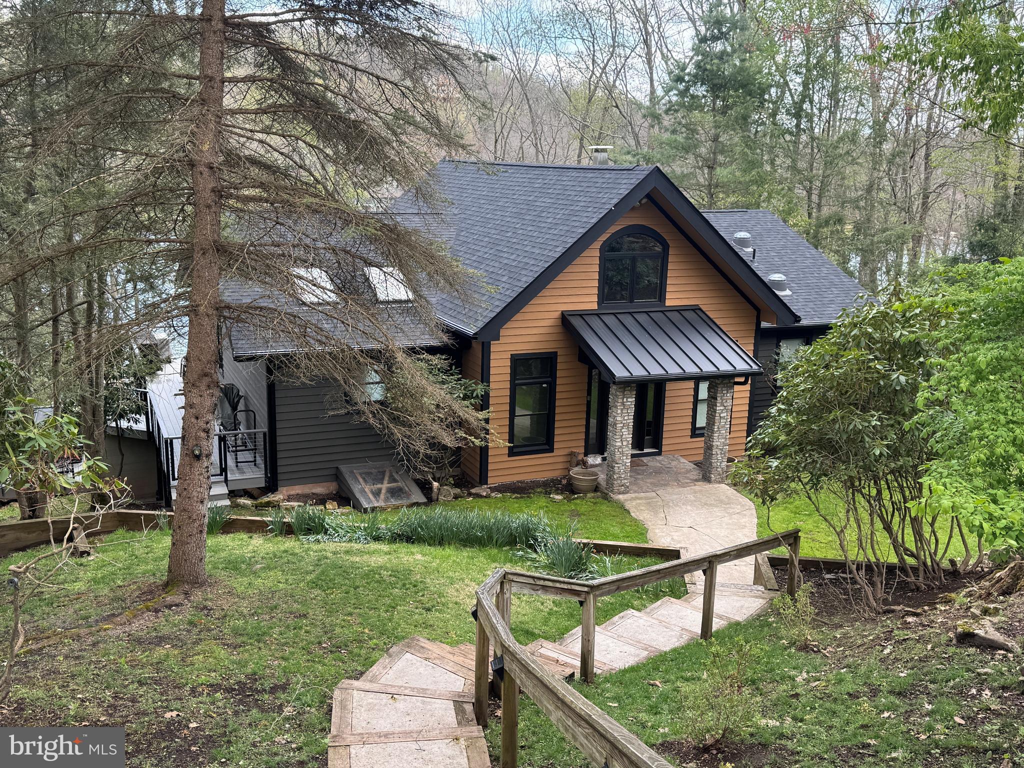 a house view with a seating space and garden