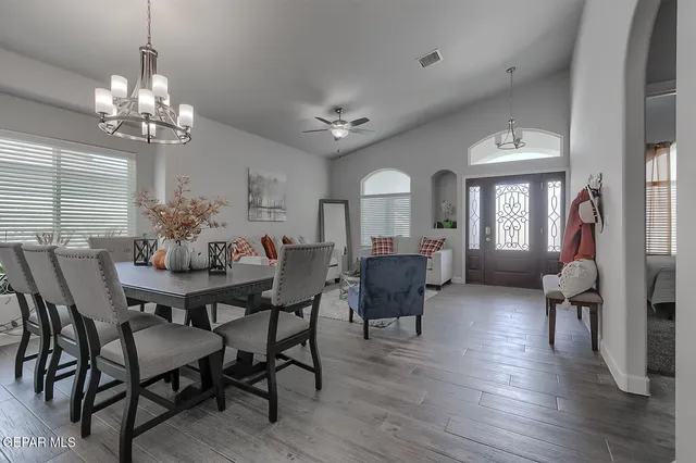 a kitchen with granite countertop a sink cabinets and stainless steel appliances