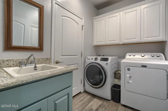 a view of a house with pool and chairs