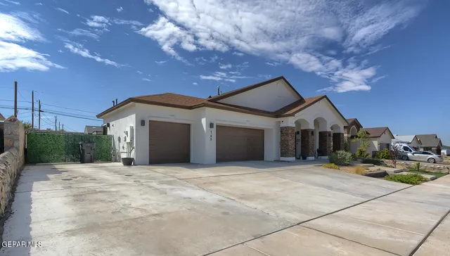 a view of a dining room with furniture a chandelier and wooden floor