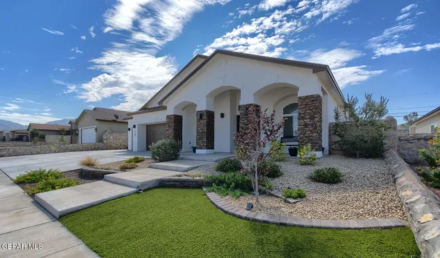 a view of a dining room with furniture a chandelier and wooden floor