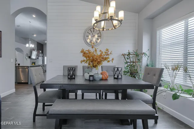 a kitchen with stainless steel appliances granite countertop a refrigerator and cabinets