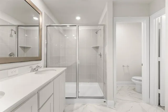 a bathroom with a granite countertop sink mirror and a