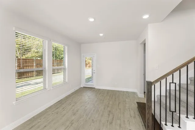 a view of entryway with wooden floor and stairs
