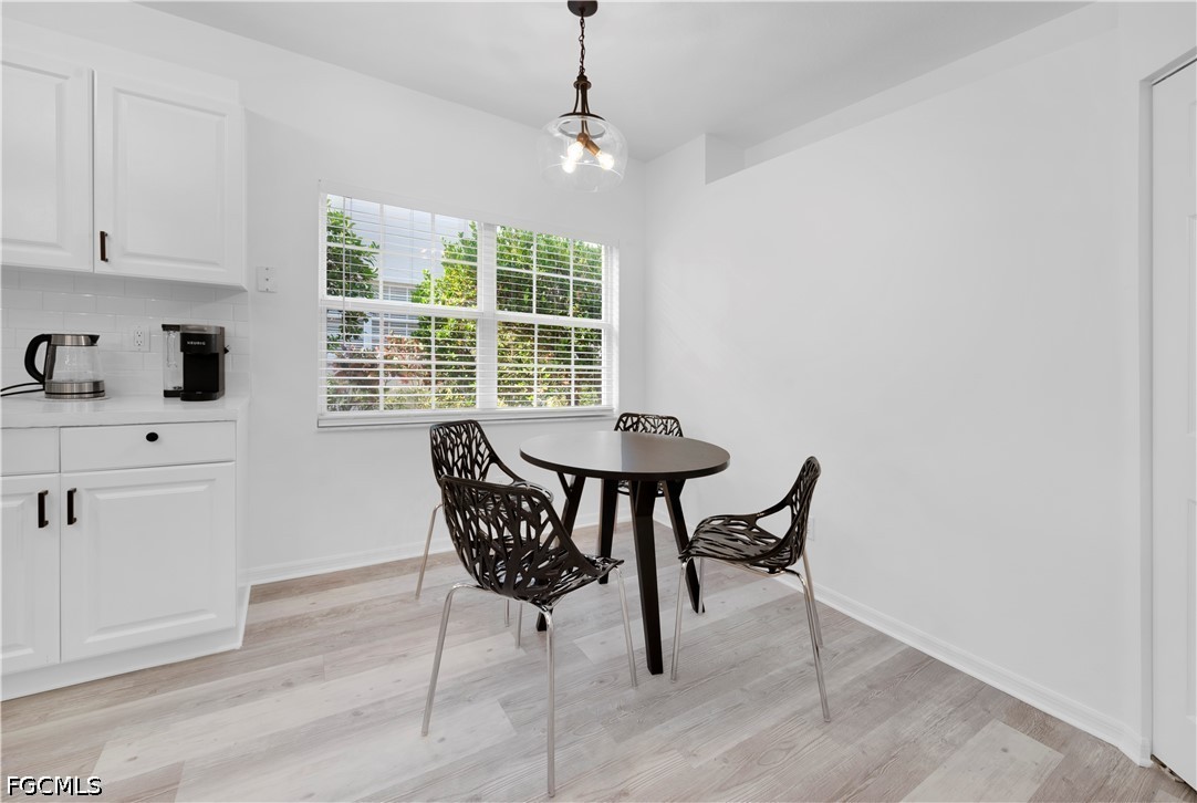 6800 Satinleaf Road South, Unit 104 Naples, FL 34109 - Photo 5 of 12 a dining room with furniture and window