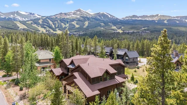 a view of a house with yard and sitting area