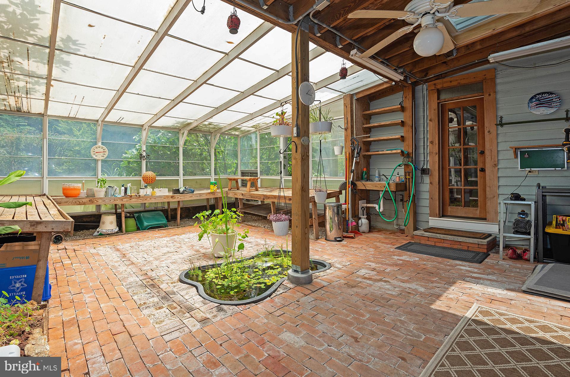 8316 Dock Road Pasadena, MD 21122 - Photo 31 of 74 Large attached greenhouse