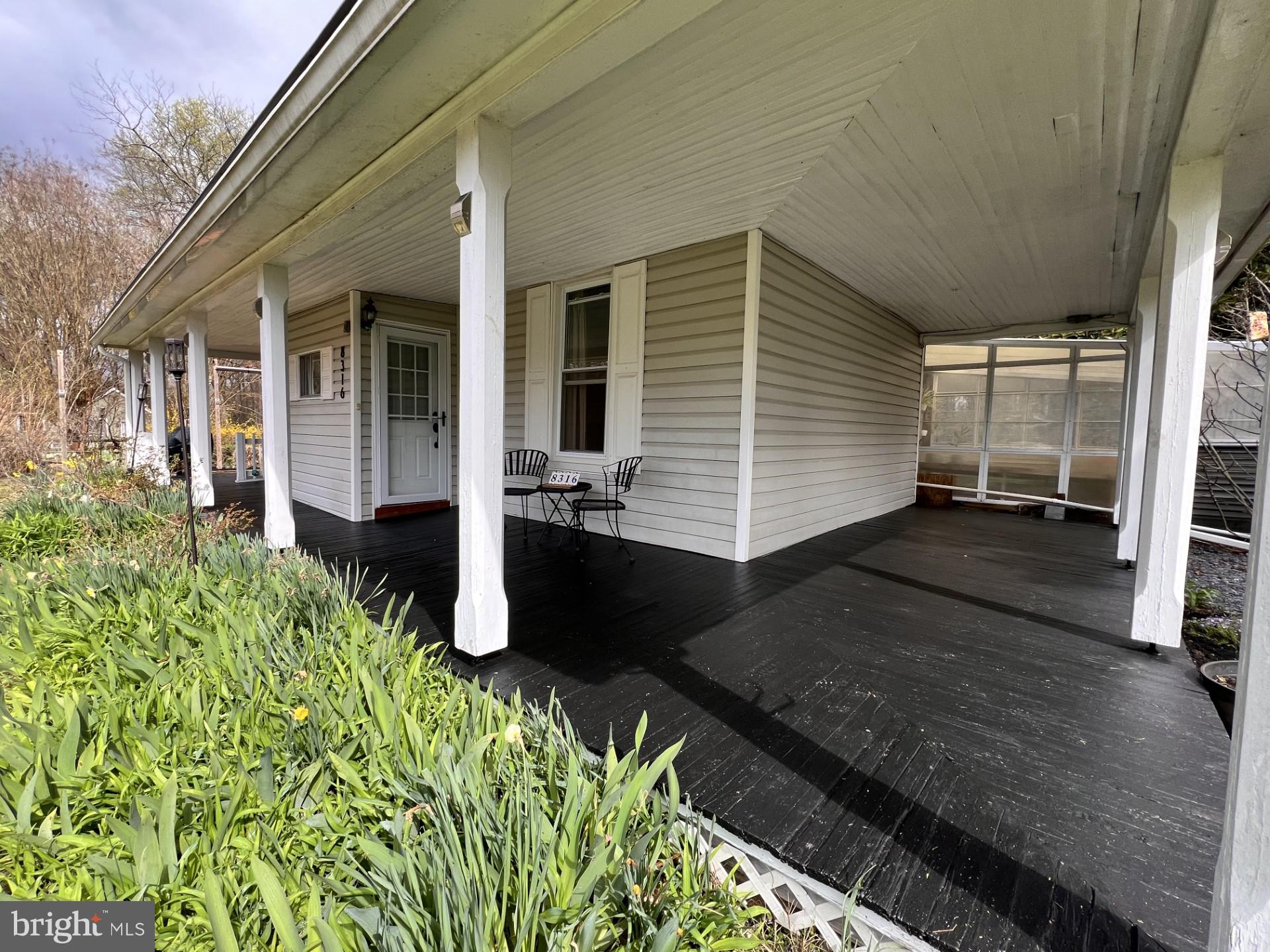 8316 Dock Road Pasadena, MD 21122 - Photo 45 of 74 Newly painted wrap-around porch