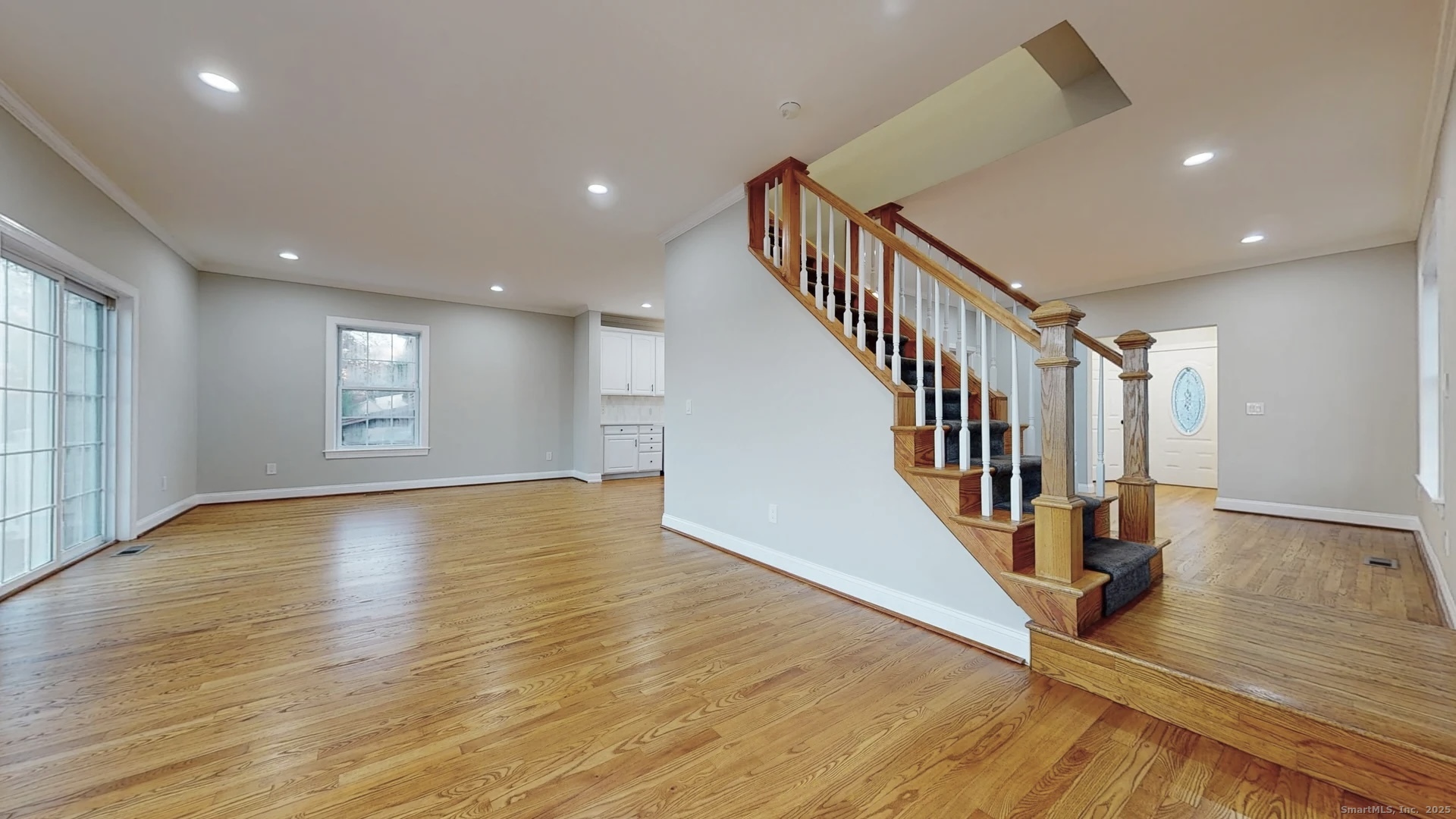 112 River Road Shelton, CT 06484 - Photo 12 of 37 a view of empty room with wooden floor and fan