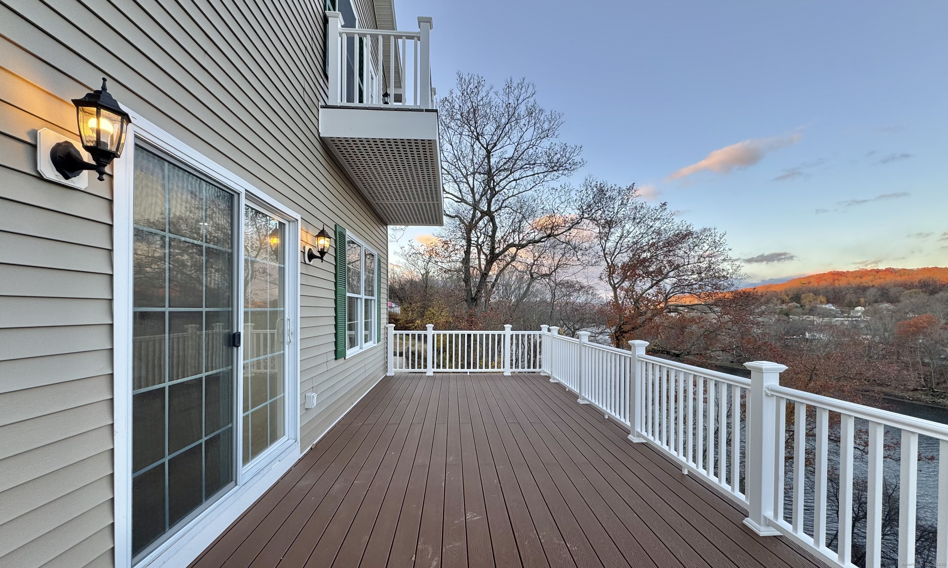 112 River Road Shelton, CT 06484 - Photo 16 of 37 a view of a balcony with wooden floor and fence