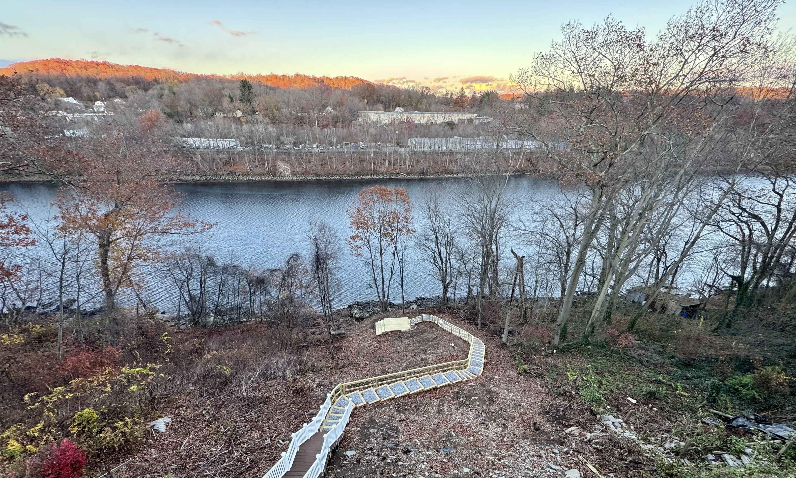 112 River Road Shelton, CT 06484 - Photo 17 of 37 a view of a backyard with large trees