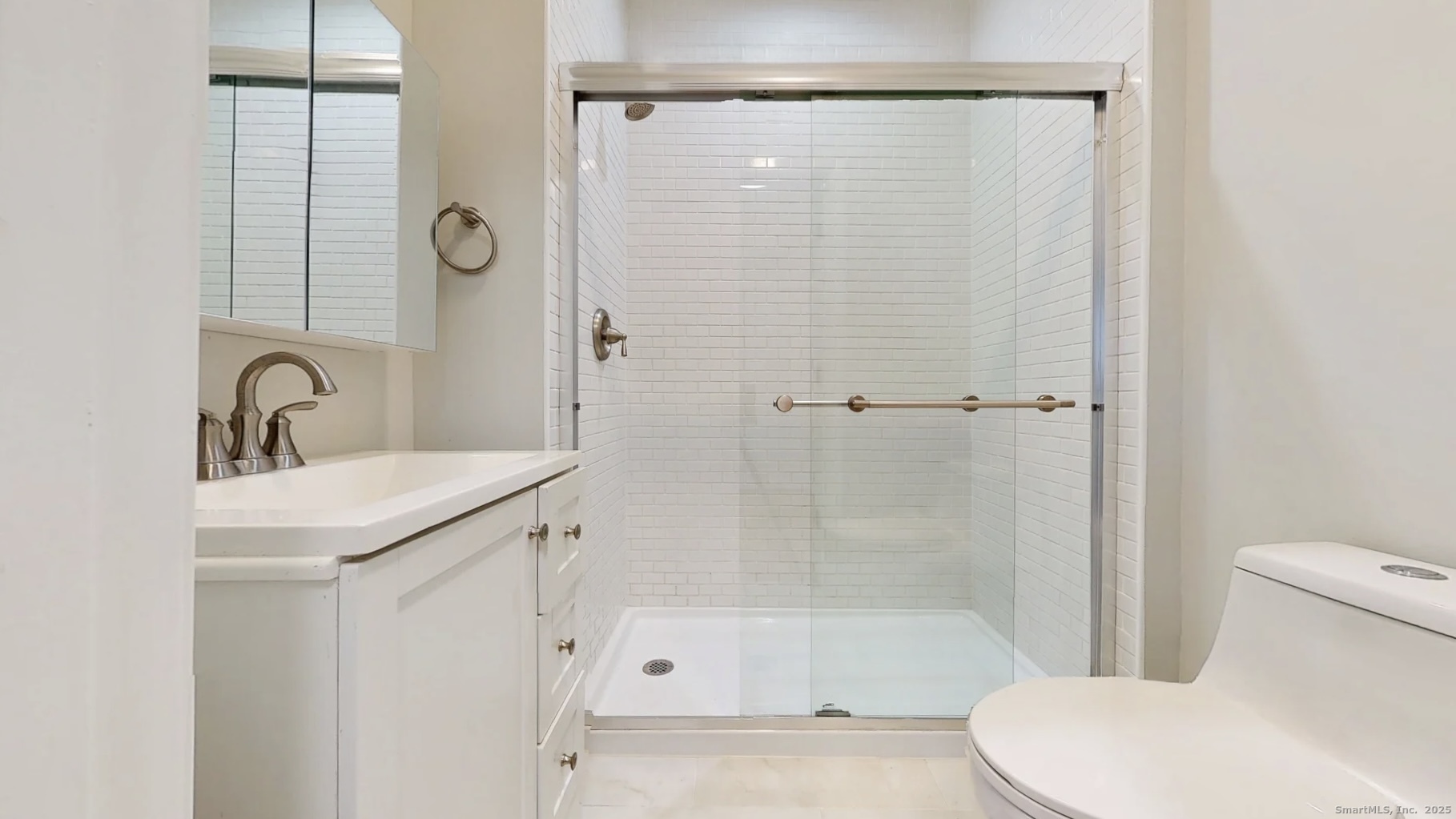 112 River Road Shelton, CT 06484 - Photo 19 of 37 a bathroom with a shower a toilet and a sink