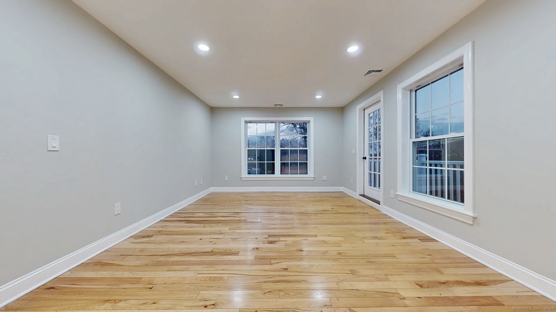 112 River Road Shelton, CT 06484 - Photo 21 of 37 a view of an empty room with a window and wooden floor