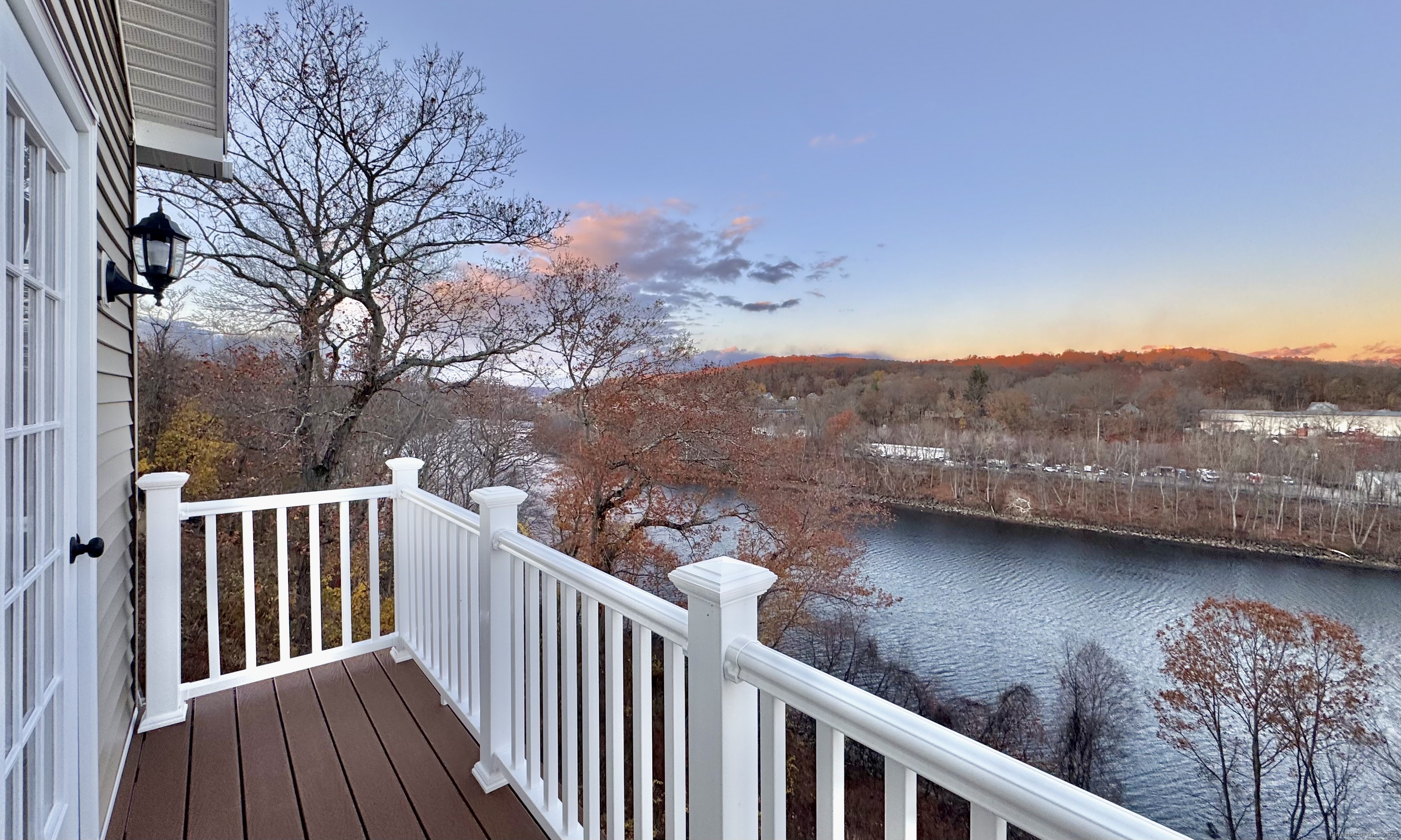 112 River Road Shelton, CT 06484 - Photo 22 of 37 a view of a balcony with wooden fence and floor