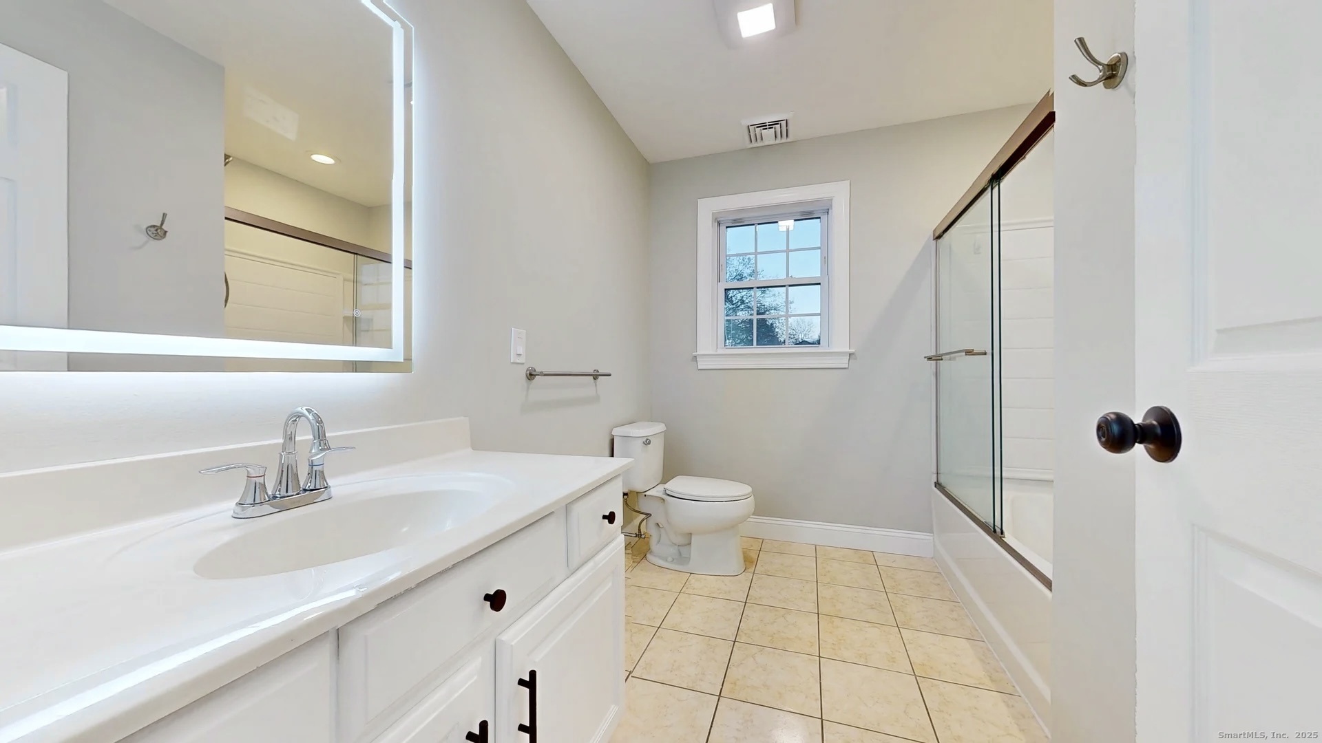 112 River Road Shelton, CT 06484 - Photo 26 of 37 a bathroom with a sink a toilet a mirror and shower