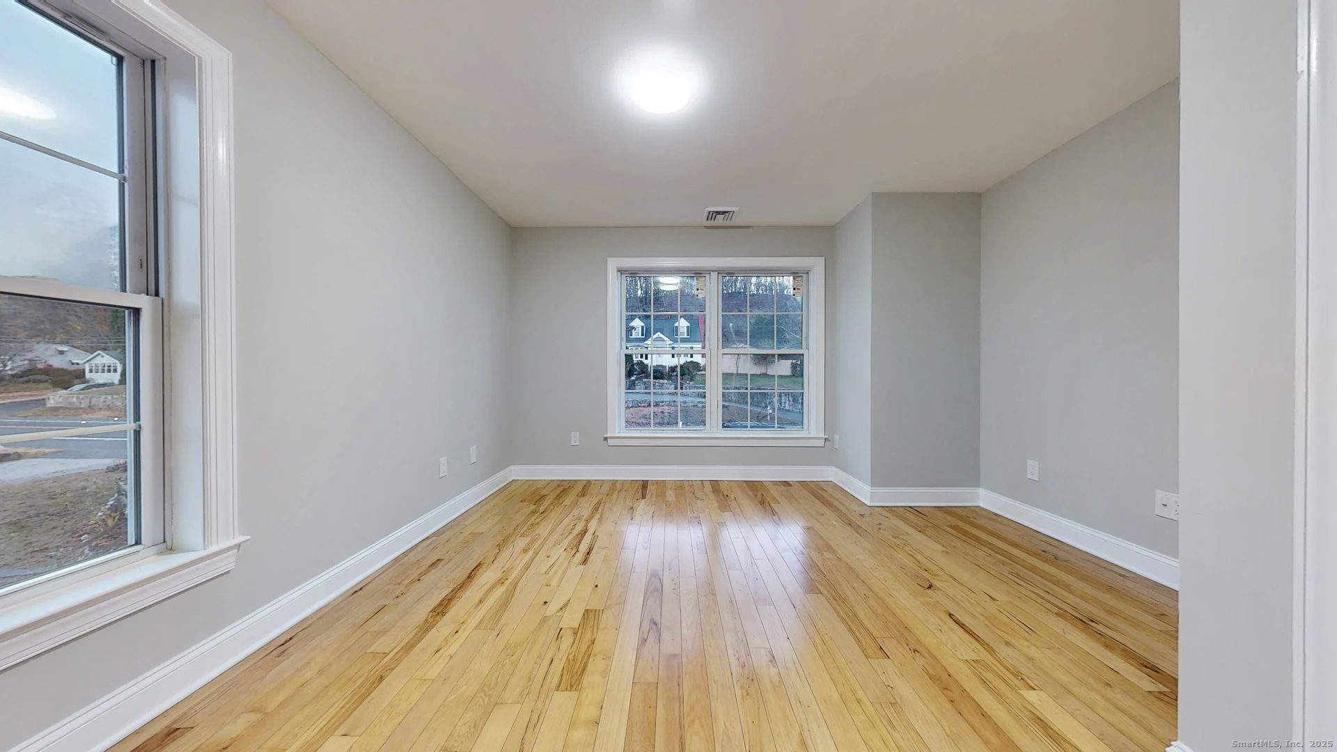 112 River Road Shelton, CT 06484 - Photo 27 of 37 a view of an empty room with wooden floor and a window
