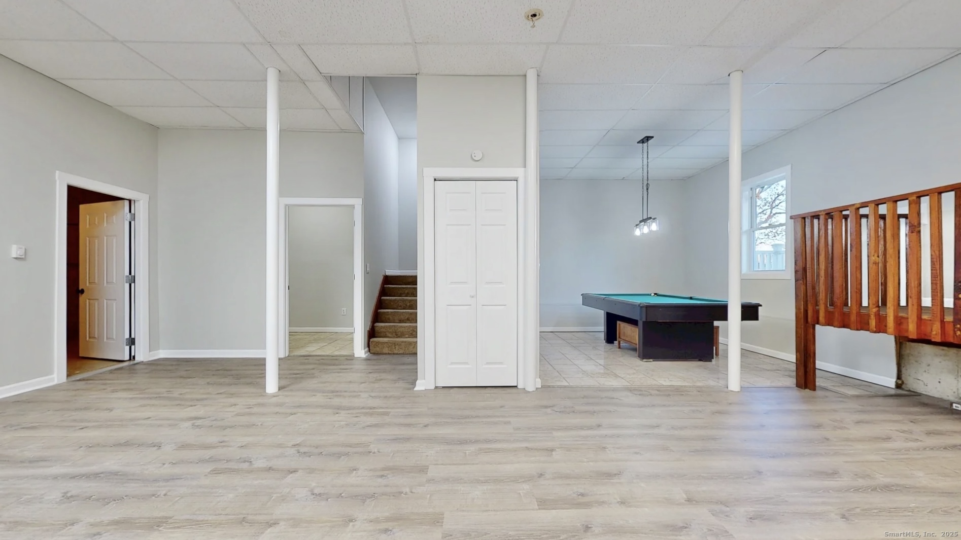 112 River Road Shelton, CT 06484 - Photo 28 of 37 an empty room with wooden floor and closet