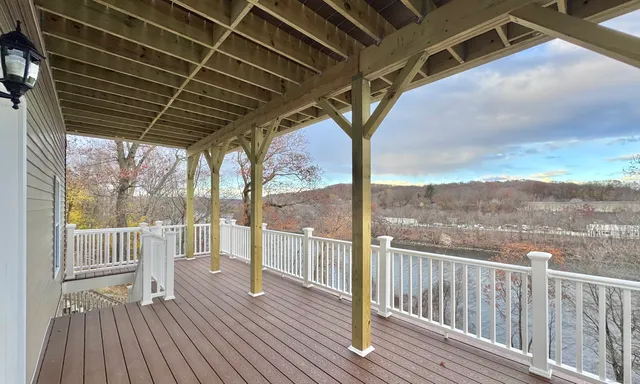 a view of a balcony with wooden floor