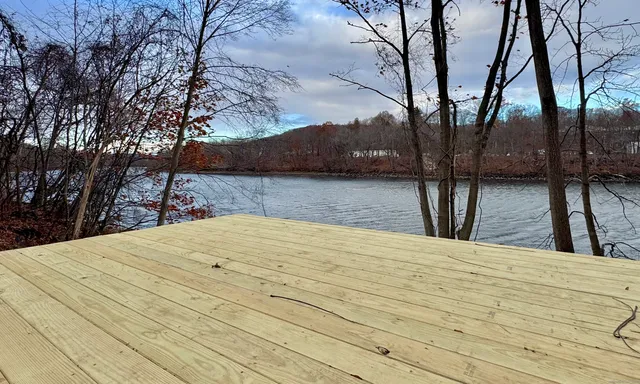a view of wooden floor and trees