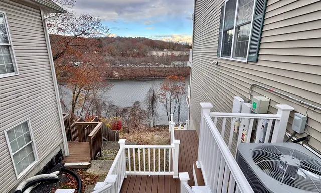 a view of balcony with furniture and wooden deck