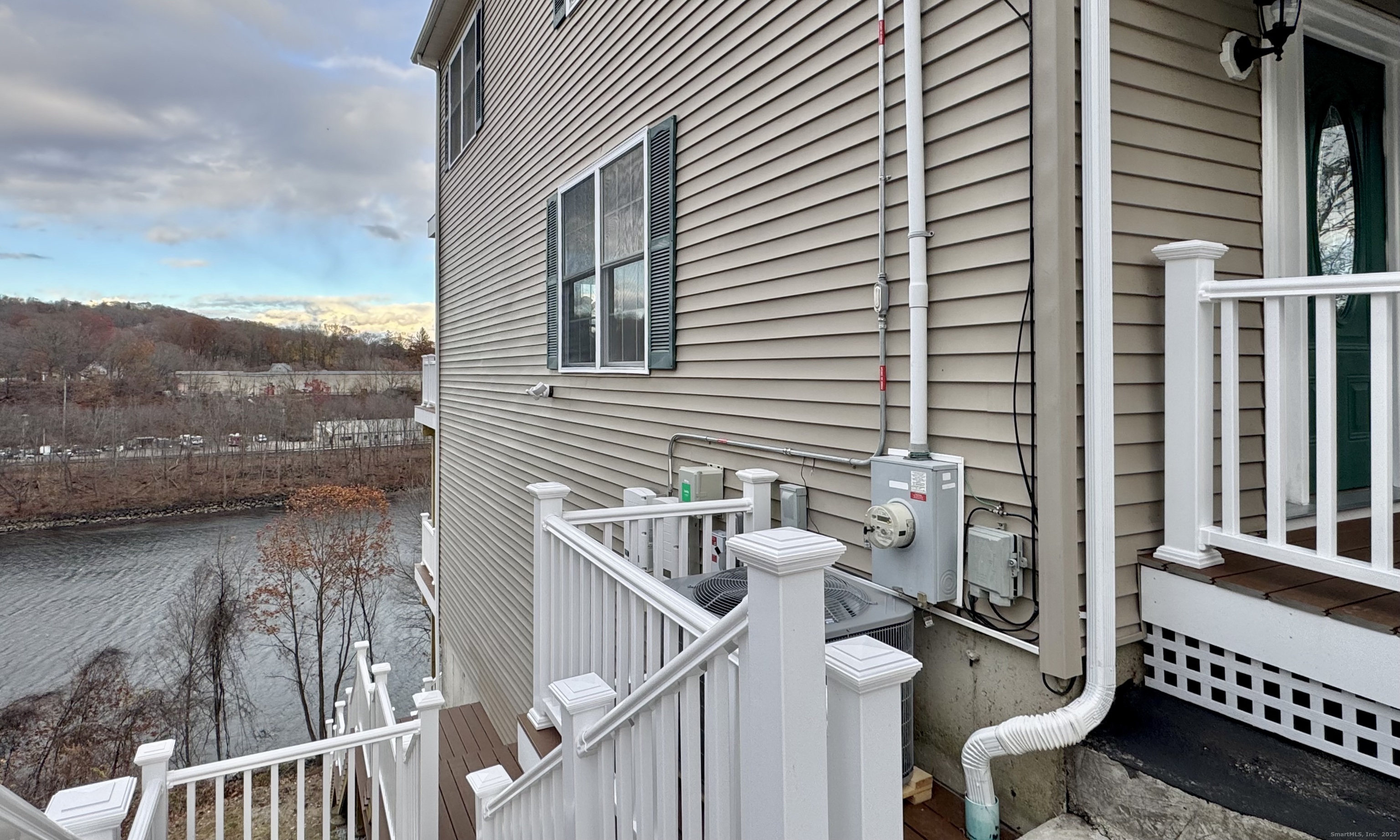 112 River Road Shelton, CT 06484 - Photo 36 of 37 a view of a balcony with chair and wooden floor