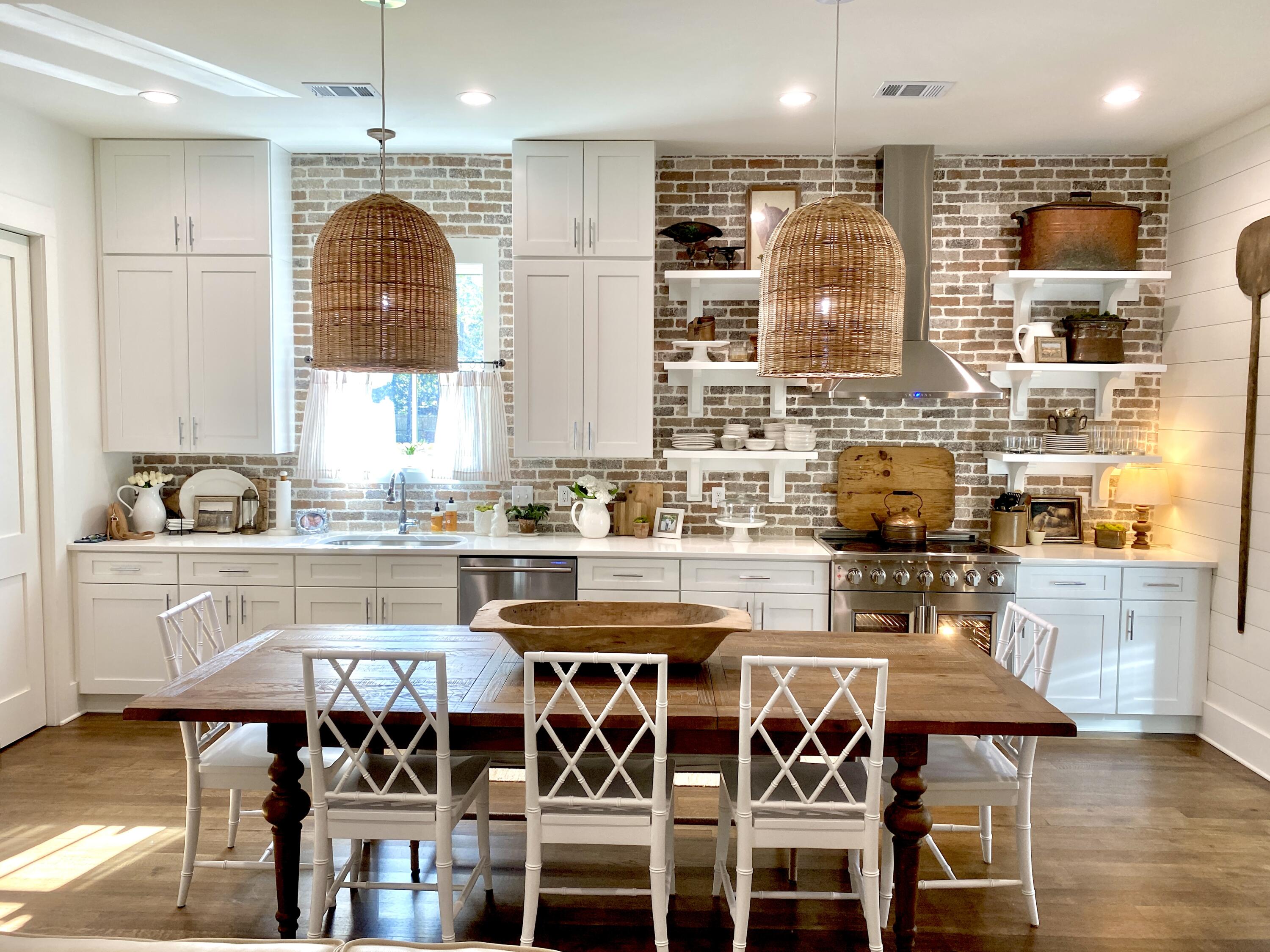426 Morrison Avenue Santa Rosa Beach, FL 32459 - Photo 6 of 18 a kitchen with stainless steel appliances granite countertop a kitchen island and chairs in it