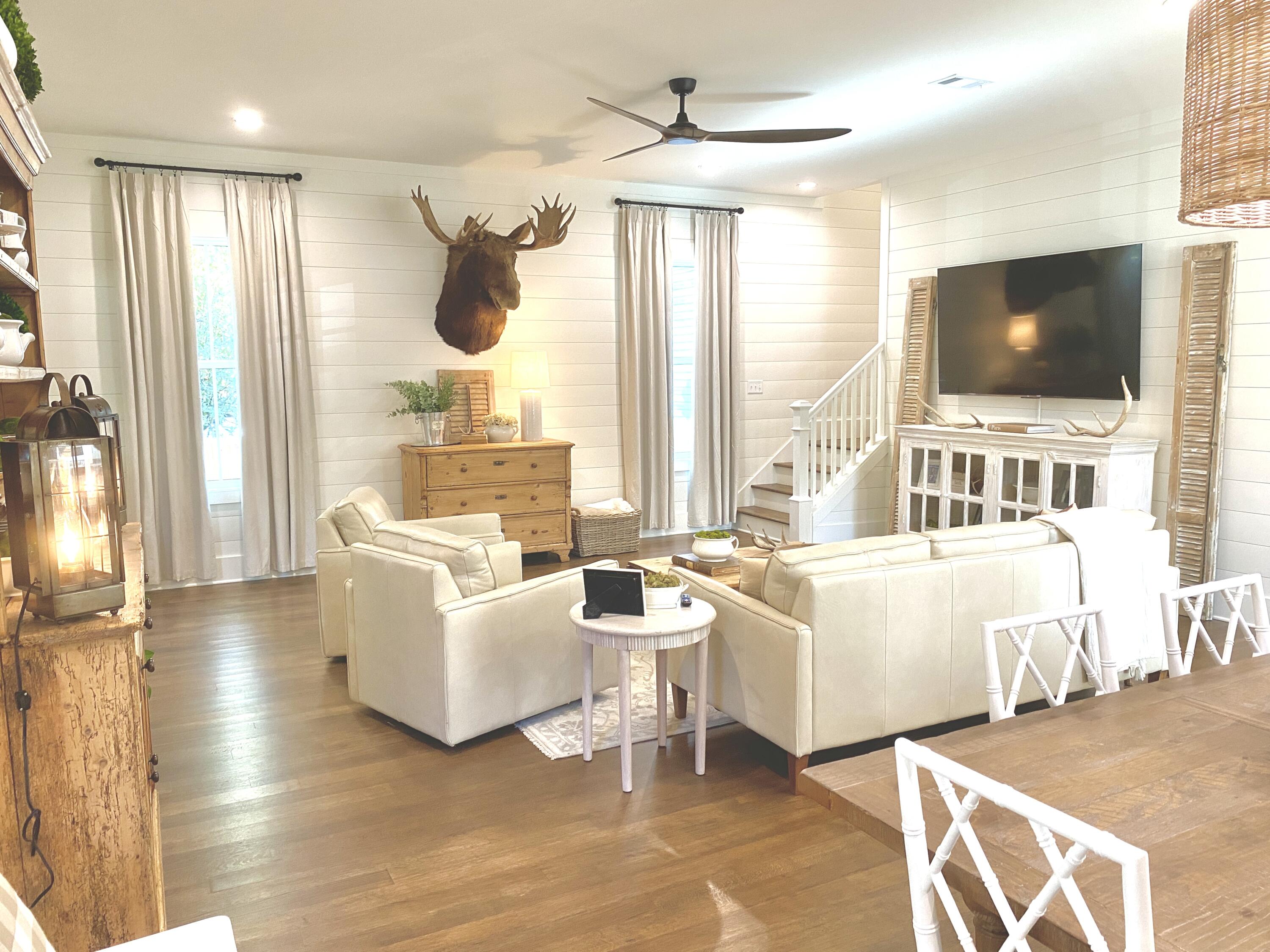 426 Morrison Avenue Santa Rosa Beach, FL 32459 - Photo 9 of 18 a living room with furniture a flat screen tv and a large window