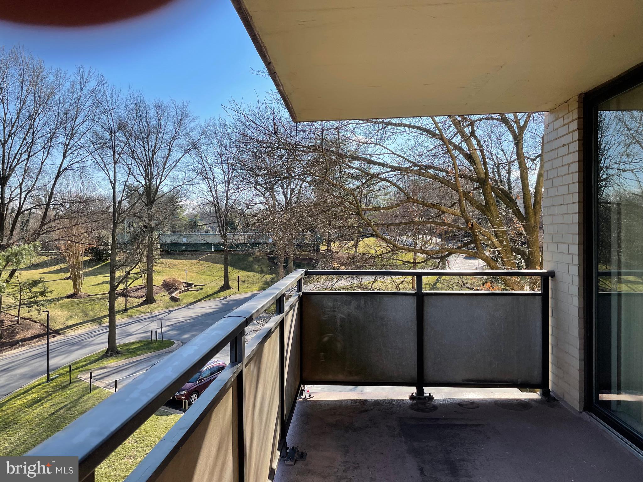 5225 Pooks Hill Road, Unit 228S Bethesda, MD 20814 - Photo 20 of 28 a view of a balcony with wooden floor and fence