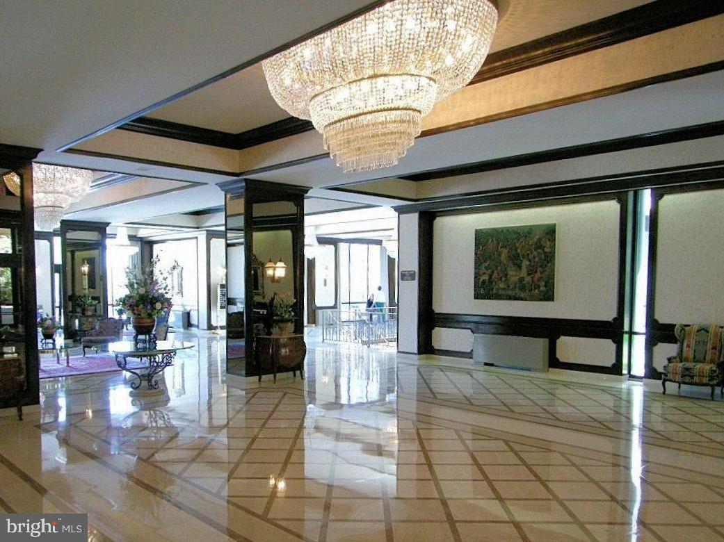 5225 Pooks Hill Road, Unit 228S Bethesda, MD 20814 - Photo 21 of 28 a lobby with furniture and chandelier