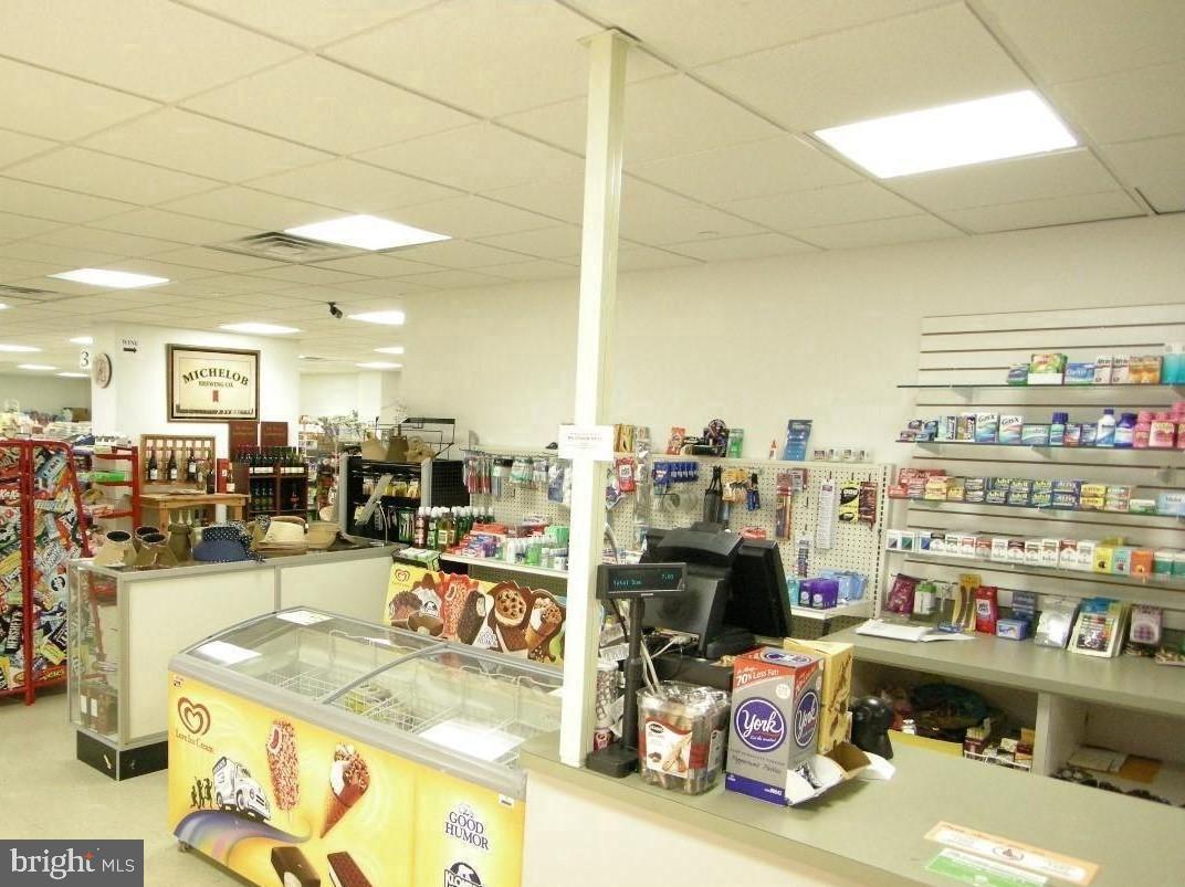 5225 Pooks Hill Road, Unit 228S Bethesda, MD 20814 - Photo 27 of 28 a room with stainless steel appliances kitchen island granite countertop a sink and cabinets