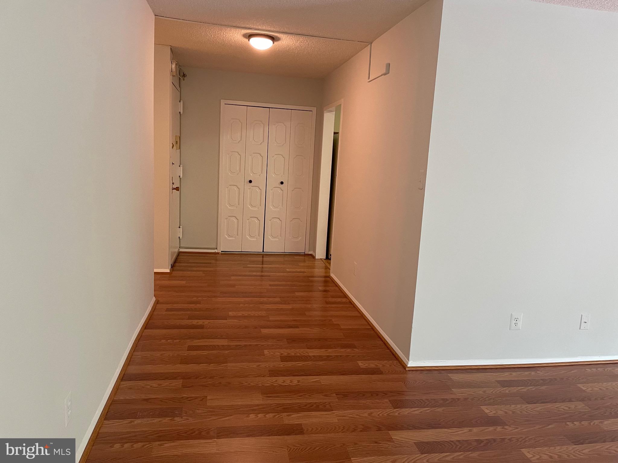 5225 Pooks Hill Road, Unit 228S Bethesda, MD 20814 - Photo 8 of 28 a view of a hallway with wooden floor
